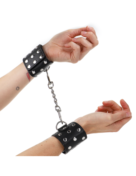 KINK - WRIST RESTRAINTS WITH SNAP FASTEN FULL OF RIVETS BLACK ADJUSTABLE 19-24 CM X 5.5 CM